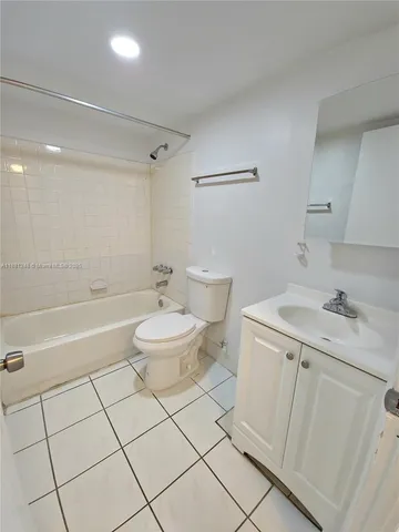 a bathroom with a sink a toilet and a bathtub