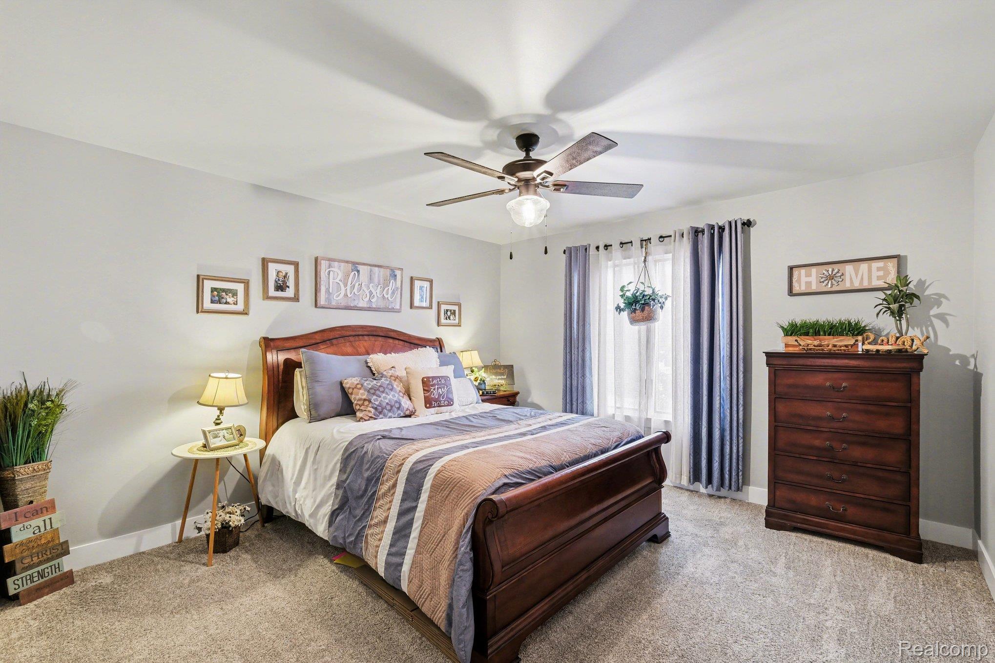 9084 Copper Ridge Drive Davison, MI 48423 - Photo 25 of 42 Bedroom with light colored carpet and ceiling fan