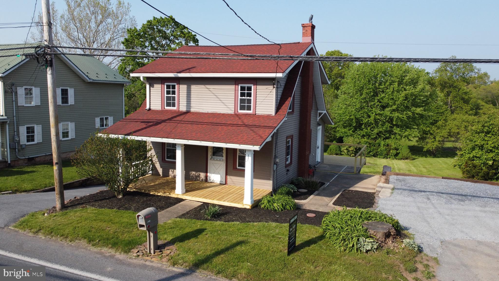 308 Highway 897 Reinholds, PA 17569 - Photo 1 of 36 a house view with a garden space