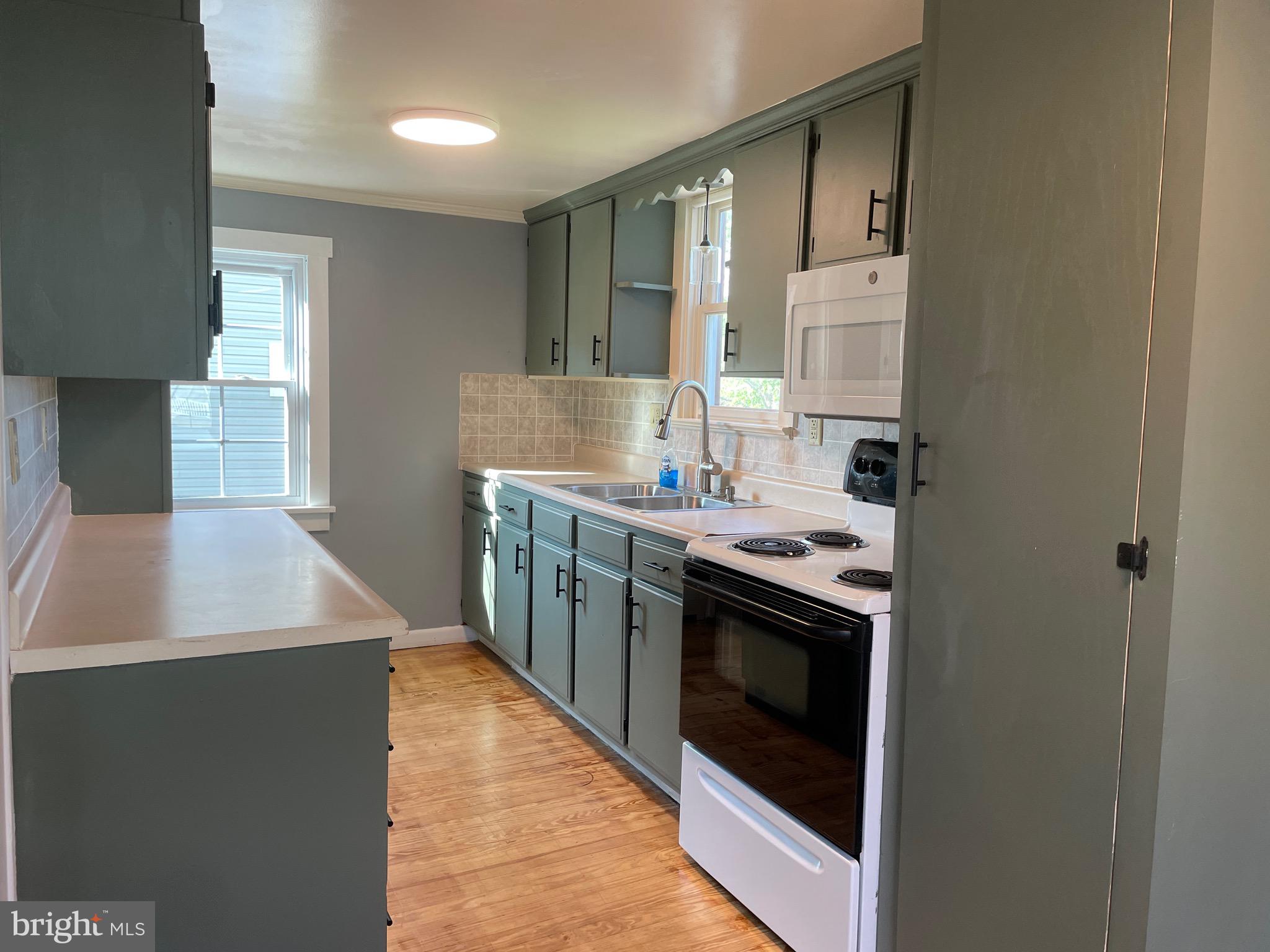 308 Highway 897 Reinholds, PA 17569 - Photo 13 of 36 a kitchen with stainless steel appliances granite countertop a stove a sink and a refrigerator