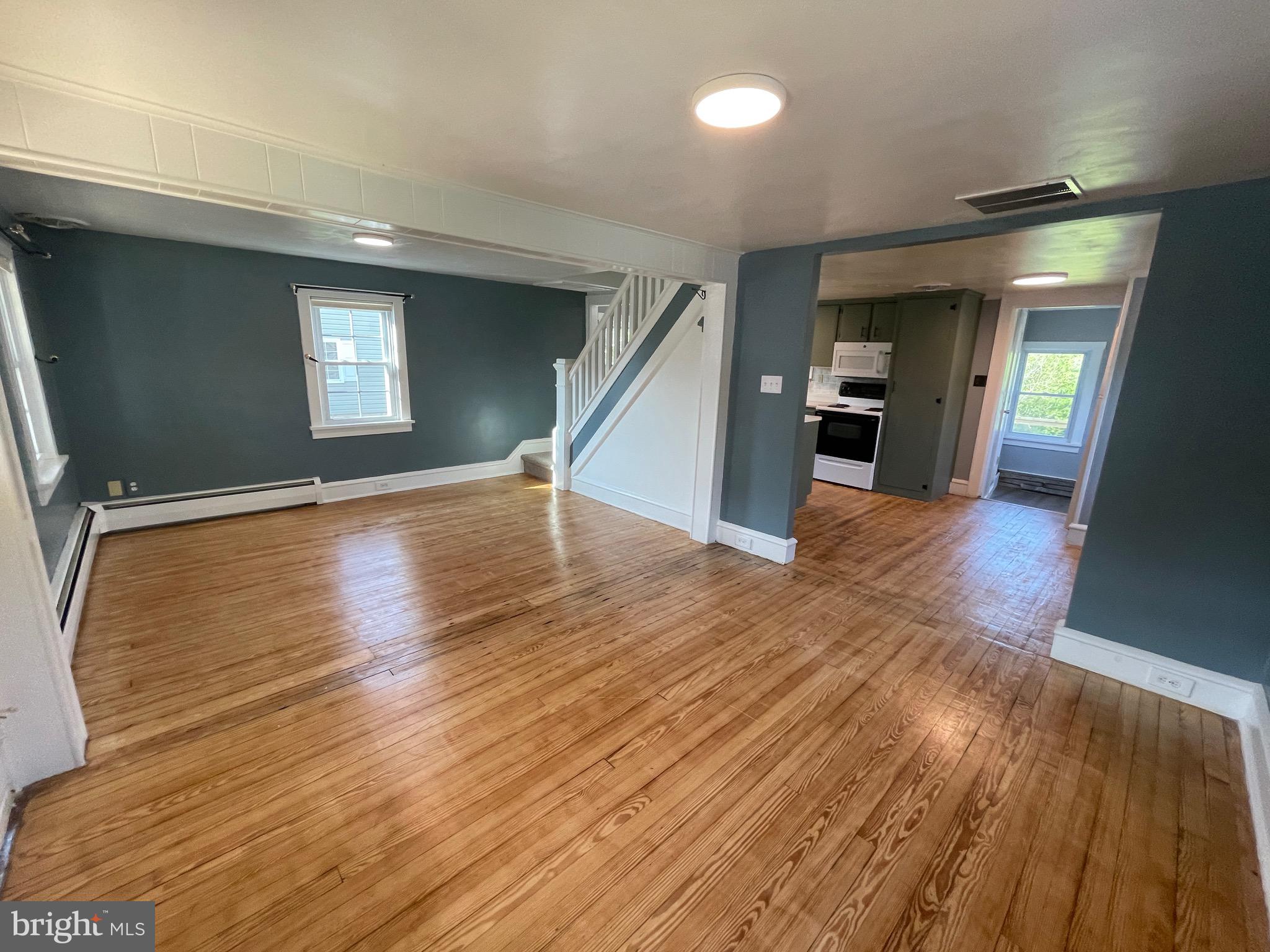 308 Highway 897 Reinholds, PA 17569 - Photo 15 of 36 wooden floor in an empty room with a window