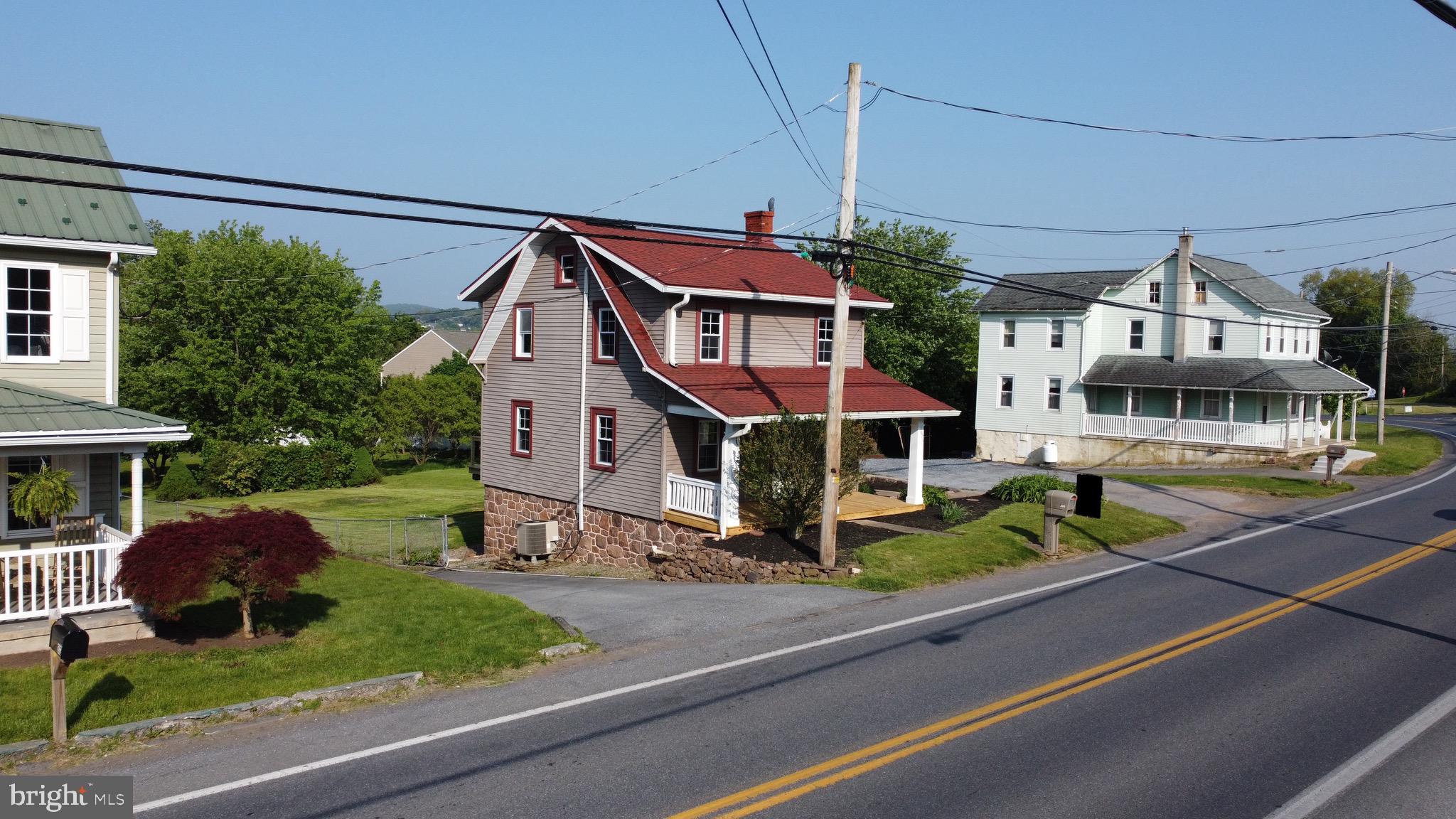 308 Highway 897 Reinholds, PA 17569 - Photo 2 of 36 a front view of residential houses with yard