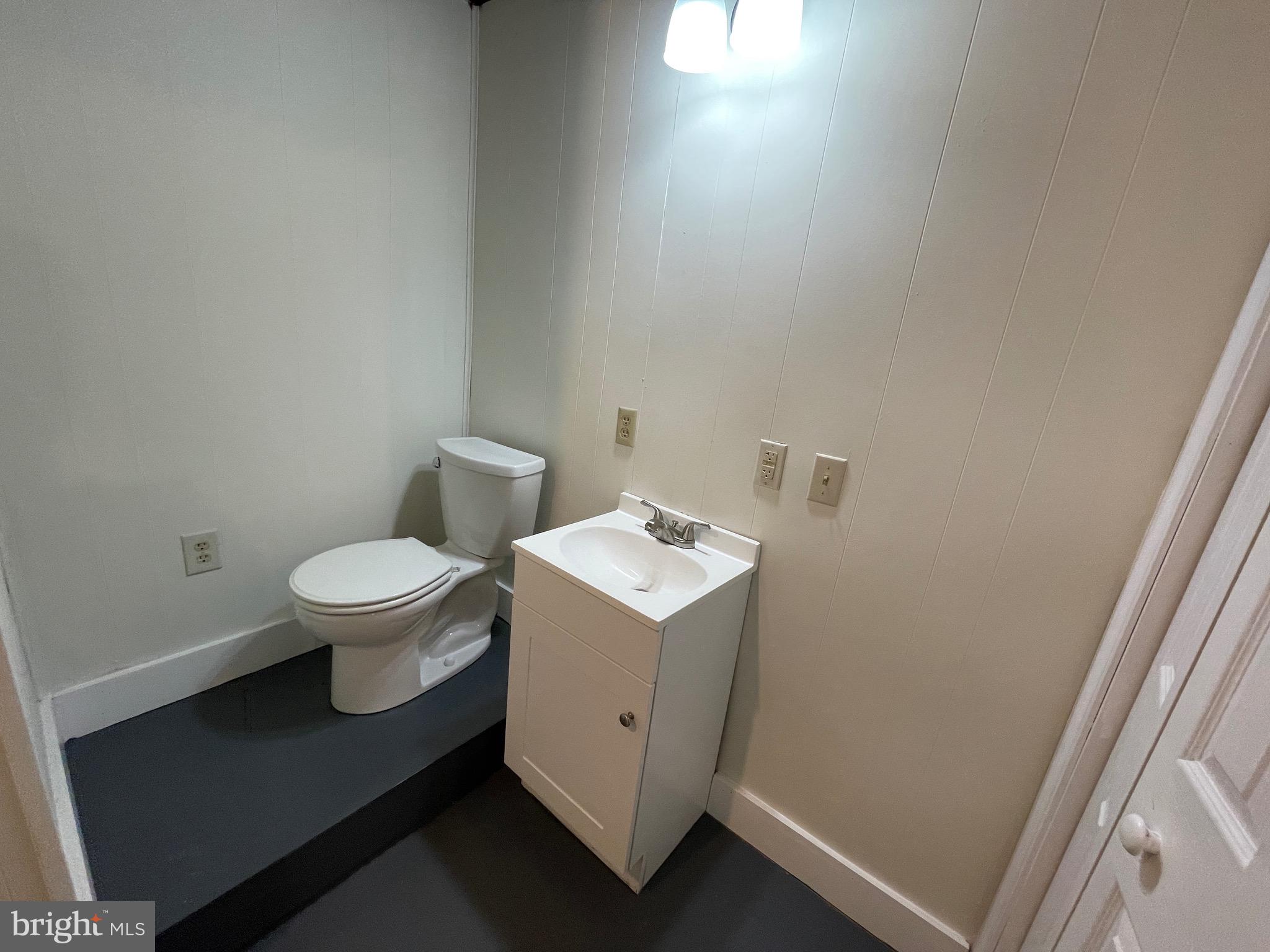 308 Highway 897 Reinholds, PA 17569 - Photo 29 of 36 a white toilet sitting next to a white sink and vanity