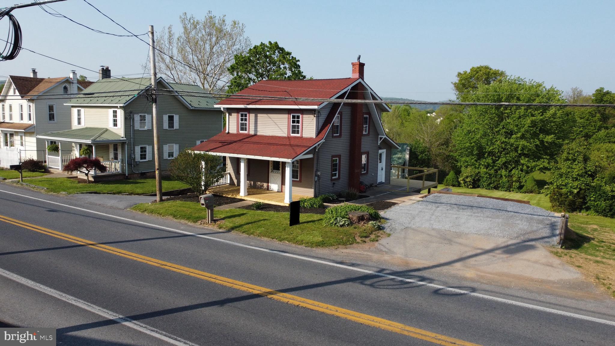 308 Highway 897 Reinholds, PA 17569 - Photo 3 of 36 front view of a brick house with a yard