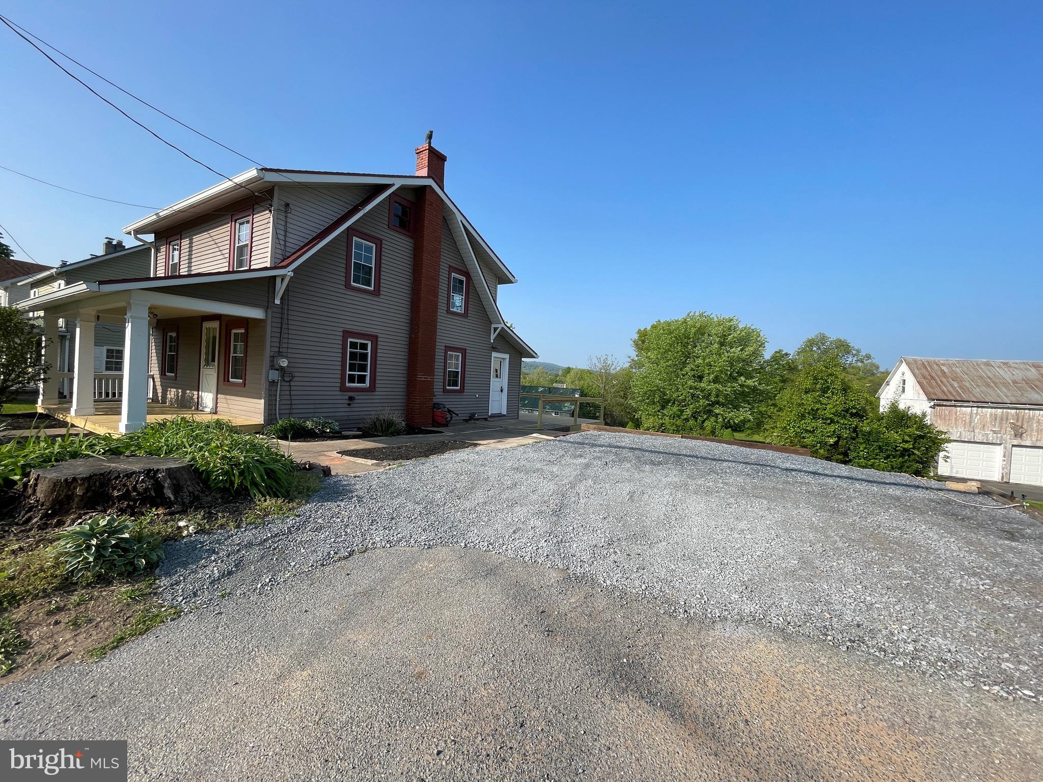 308 Highway 897 Reinholds, PA 17569 - Photo 7 of 36 a front view of a house with a yard
