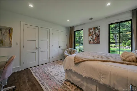 a bedroom with a large bed and a window