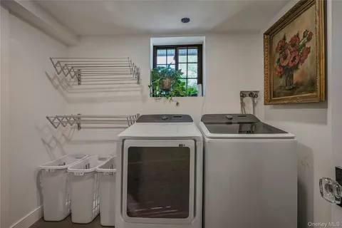 a utility room with a sink a washer and dryer