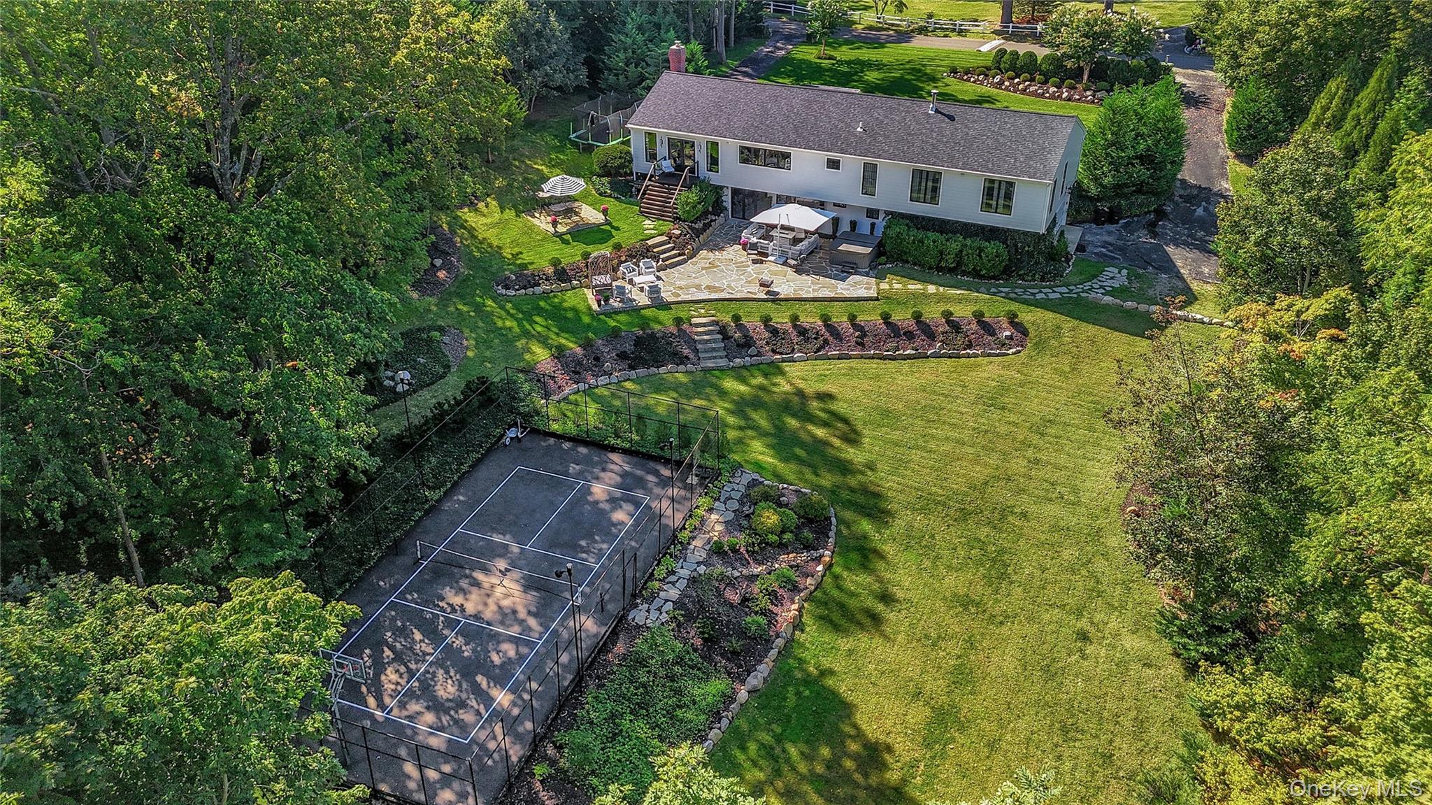262 Huntington Bay Road Huntington Bay, NY 11743 - Photo 31 of 39 a view of a house with a yard and garden