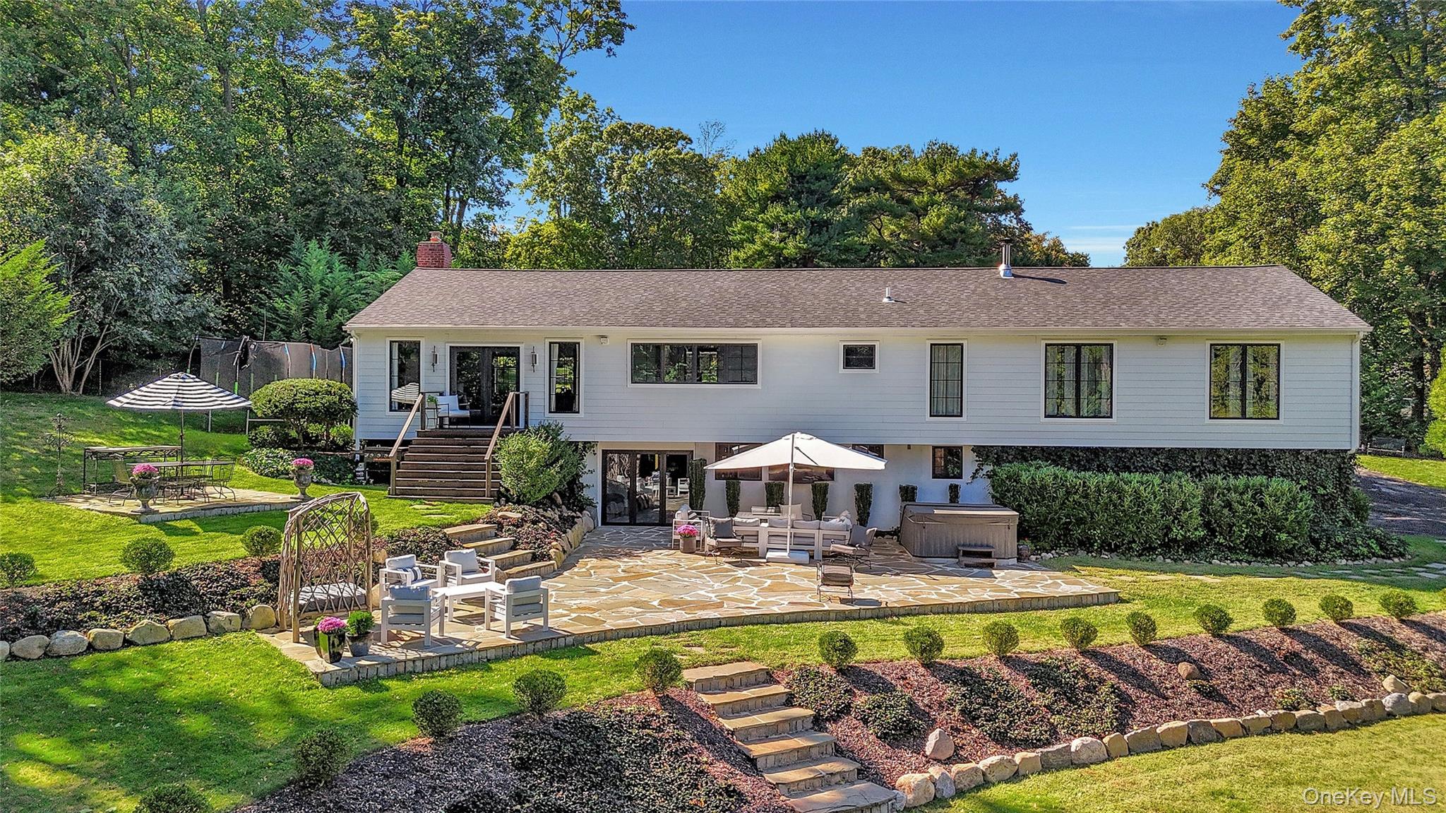 262 Huntington Bay Road Huntington Bay, NY 11743 - Photo 33 of 39 a view of a house with swimming pool and a yard