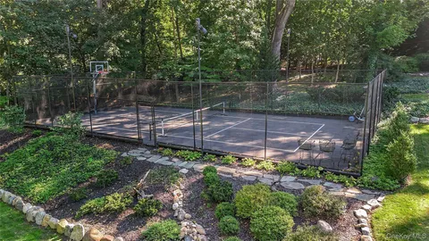 a view of a backyard with plants and a patio