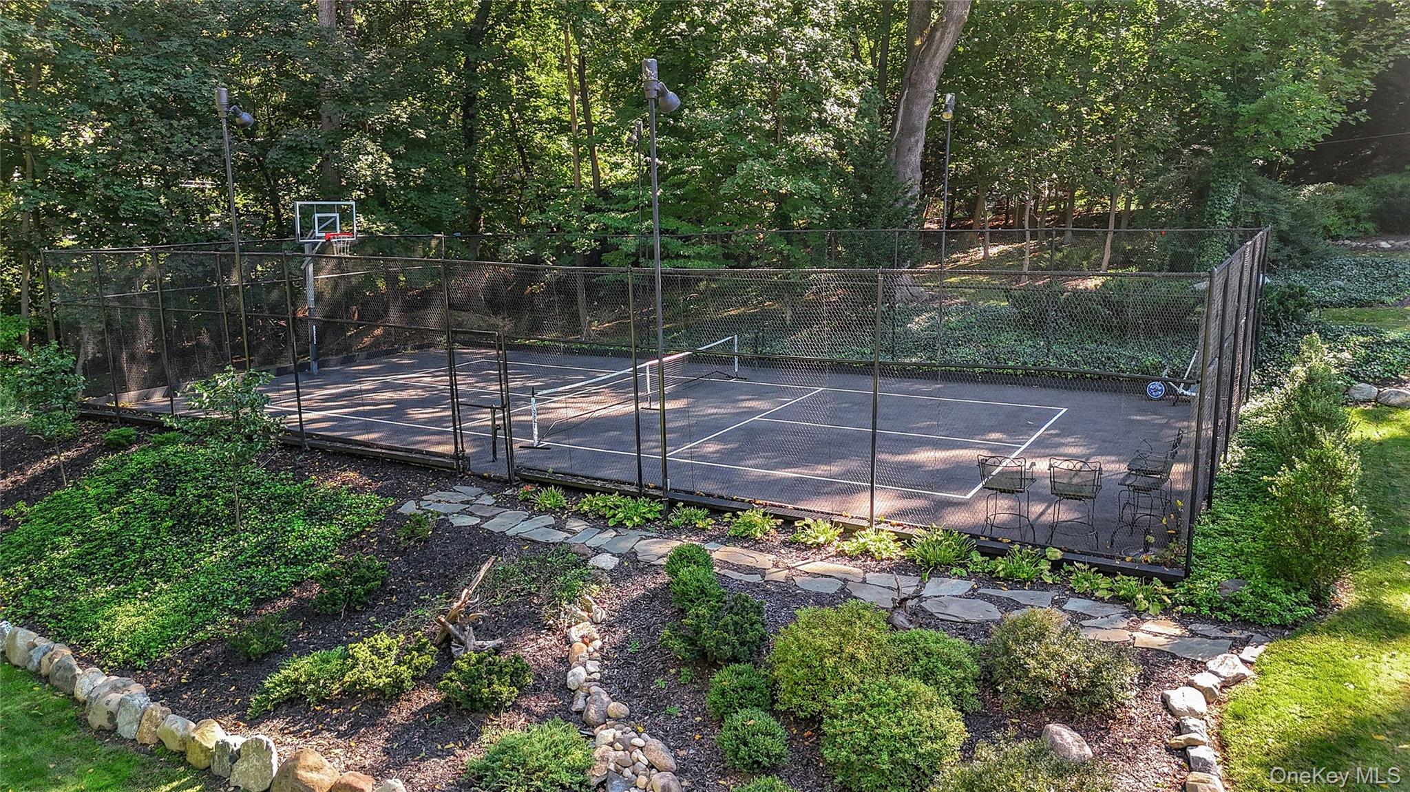 262 Huntington Bay Road Huntington Bay, NY 11743 - Photo 36 of 39 a view of a backyard with plants and a patio