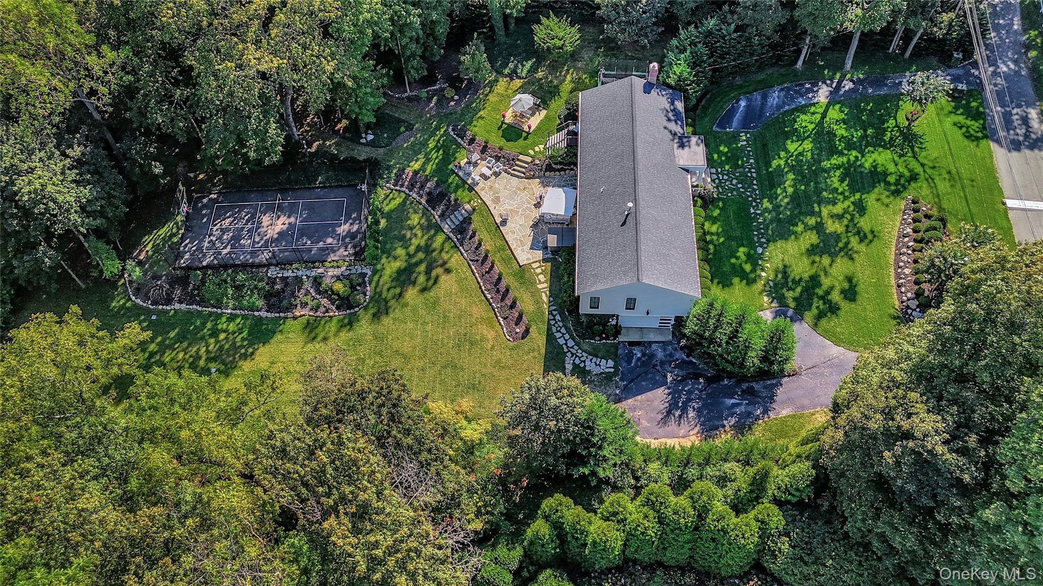 262 Huntington Bay Road Huntington Bay, NY 11743 - Photo 37 of 39 an aerial view of a house with a yard and garden