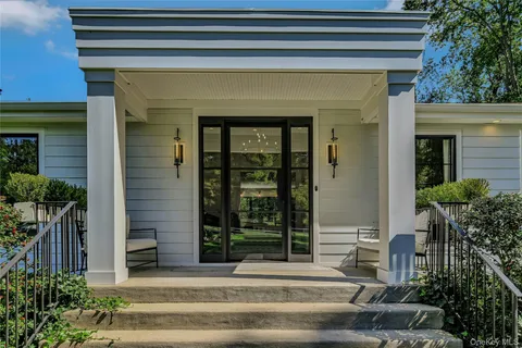 a front view of a house with a porch