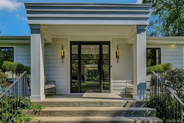 a front view of a house with a porch
