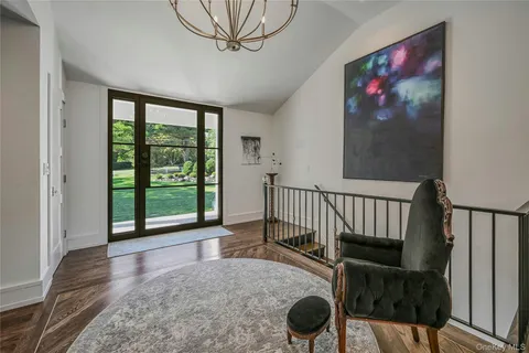 a view of a porch with wooden floor and windows