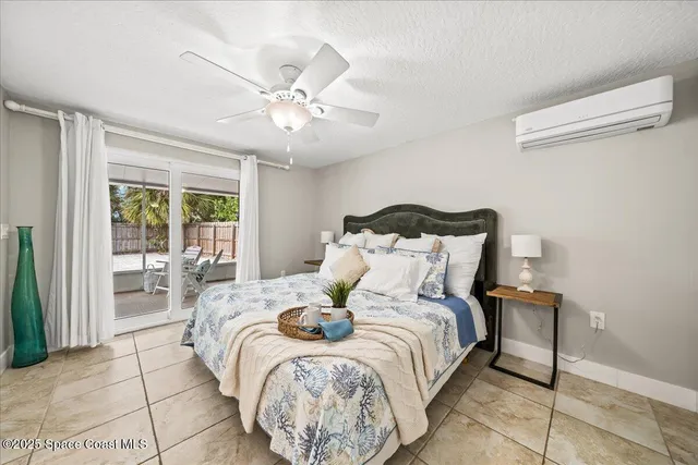 a large bed sitting in a bedroom next to a window