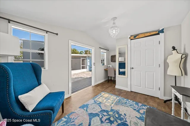 a bedroom with furniture and a rug