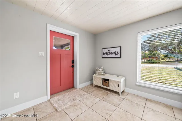 a view of a bedroom with window and a bed
