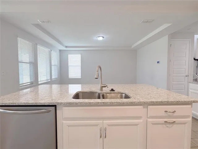 a view of empty room with windows