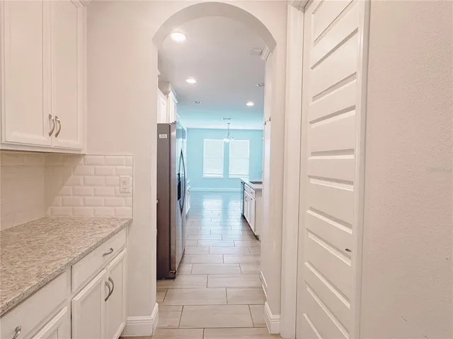 a view of a lake with houses in the back