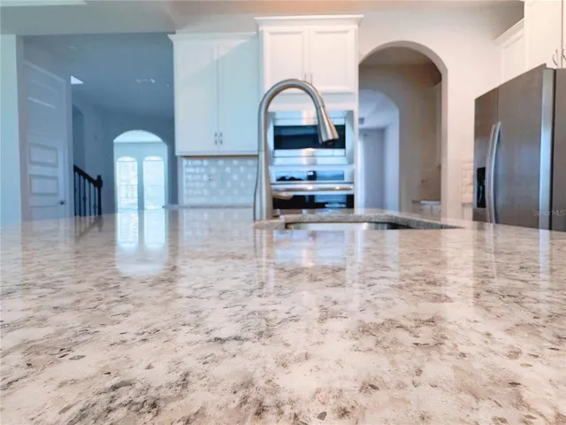 a view of a big yard with lots of green space and lake view