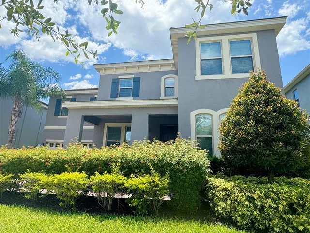 a view of an empty room and wooden floor