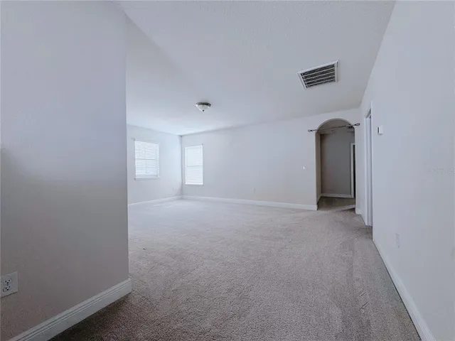 a group of cars parked in front of a house