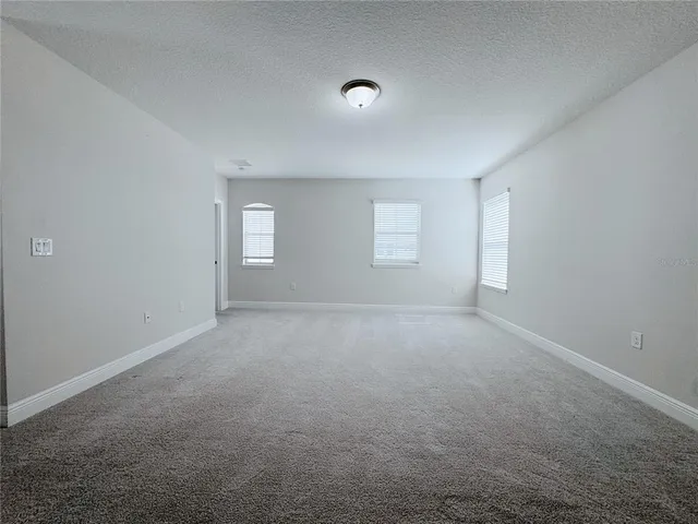 an aerial view of residential houses with outdoor space and swimming pool
