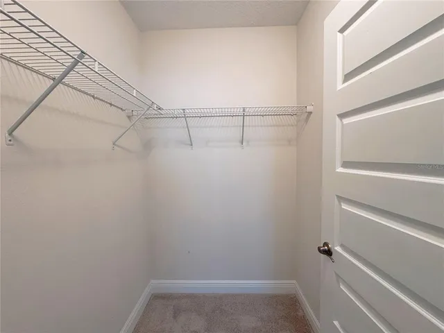 a view of a park with swings and slides