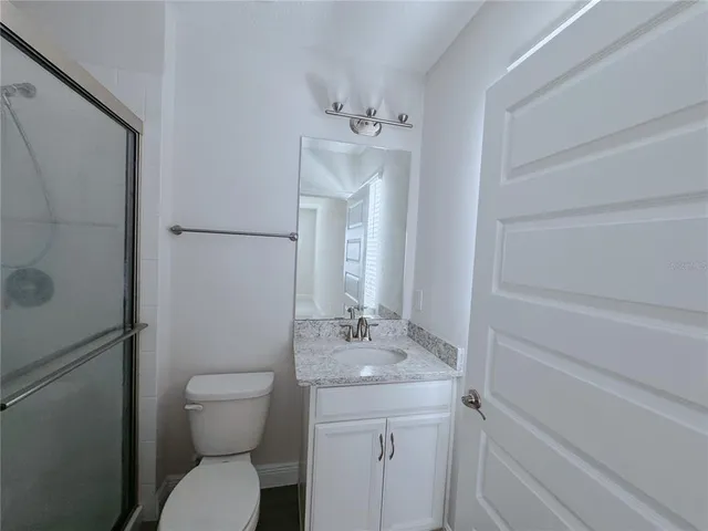 a view of a table and chairs under an umbrella