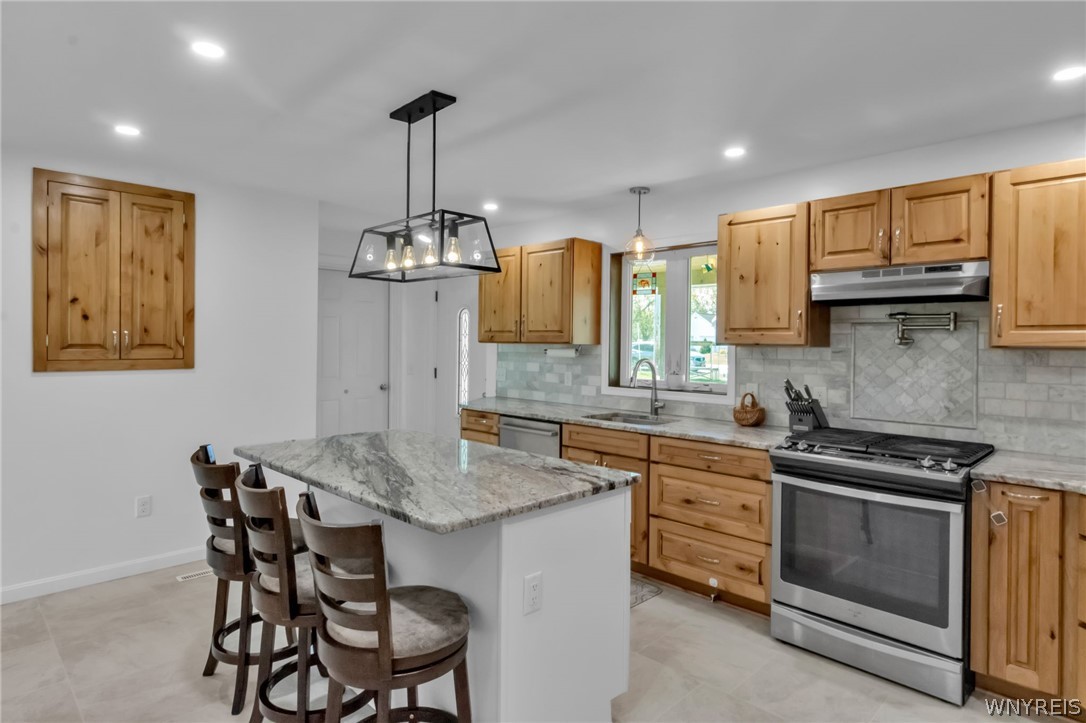 7318 Michael Road Orchard Park, NY 14127 - Photo 6 of 30 Gas stove and Pot filler