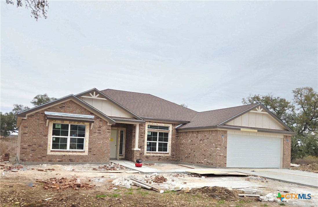 1412 Fossil Trail Belton, TX 76513 - Photo 3 of 9 a front view of a house with a yard and garage