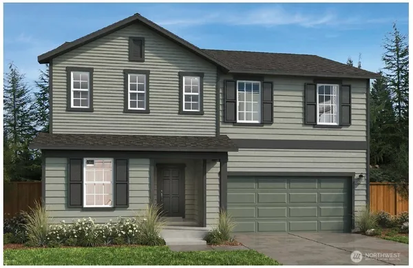 a front view of a house with garage
