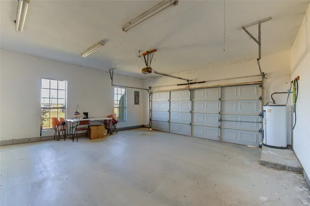 a view of a livingroom with furniture and a window