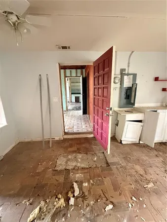 a view of an empty room with a fireplace