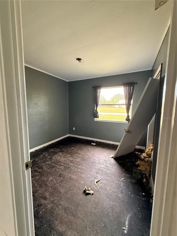 40 Hall Street Frostproof, FL 33843 - Photo 17 of 18 a view of an empty room and a window