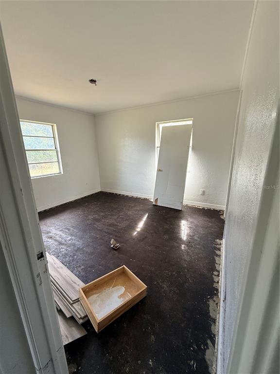 40 Hall Street Frostproof, FL 33843 - Photo 2 of 18 an empty room with wooden floor