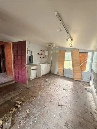 a view of a kitchen with furniture and a window