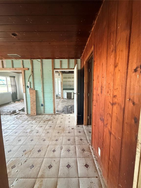 40 Hall Street Frostproof, FL 33843 - Photo 9 of 18 a big room with wooden floor and windows