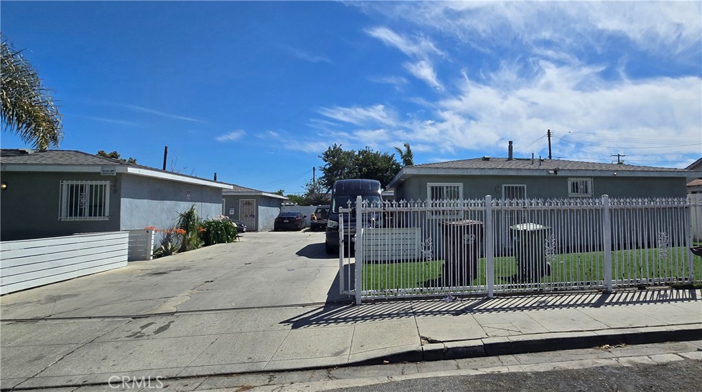 a view of a house next to a yard
