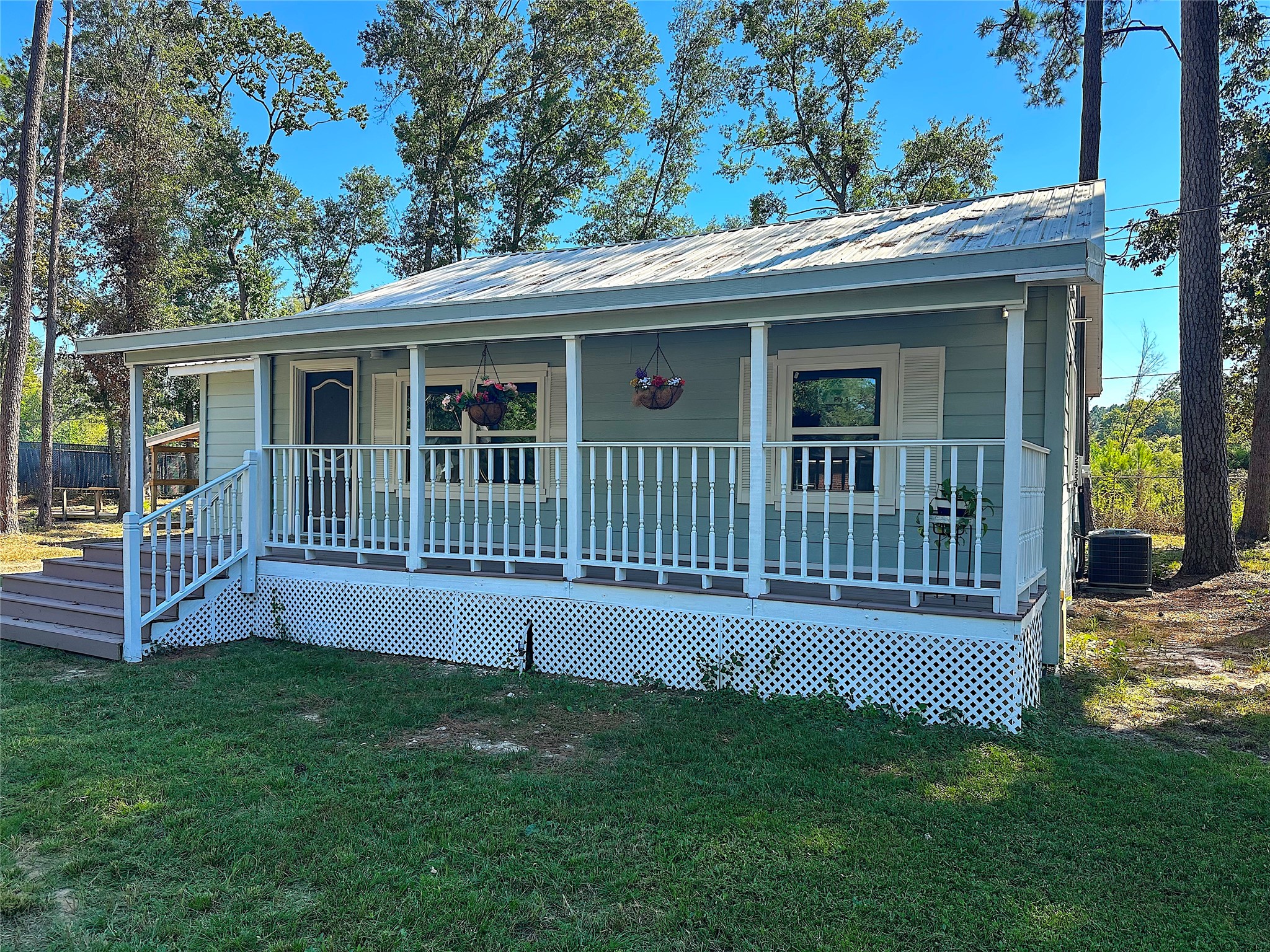 24254 Jane Avenue Porter, TX 77365 - Photo 22 of 26 a view of a house with a deck and a yard