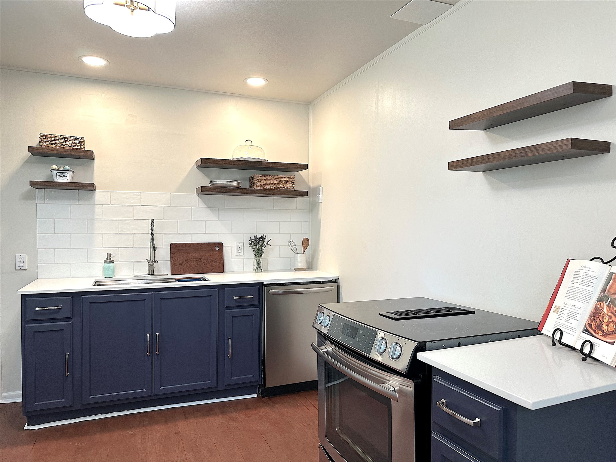 24254 Jane Avenue Porter, TX 77365 - Photo 6 of 26 a kitchen with a stove and a sink
