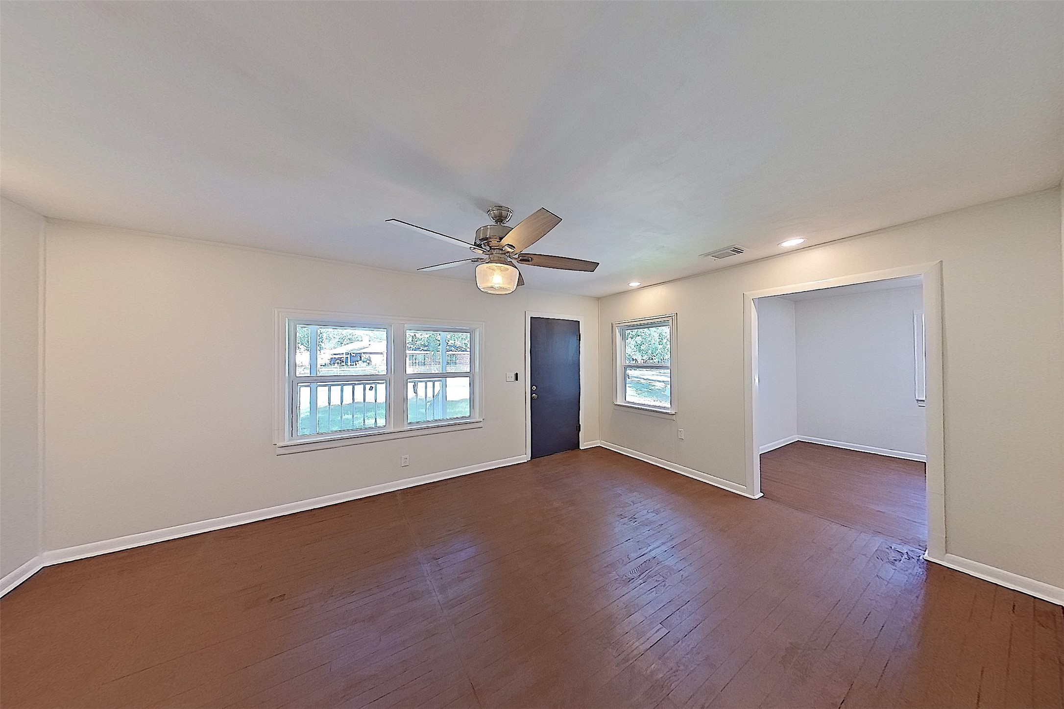 24254 Jane Avenue Porter, TX 77365 - Photo 9 of 26 a view of an empty room with a window and wooden floor