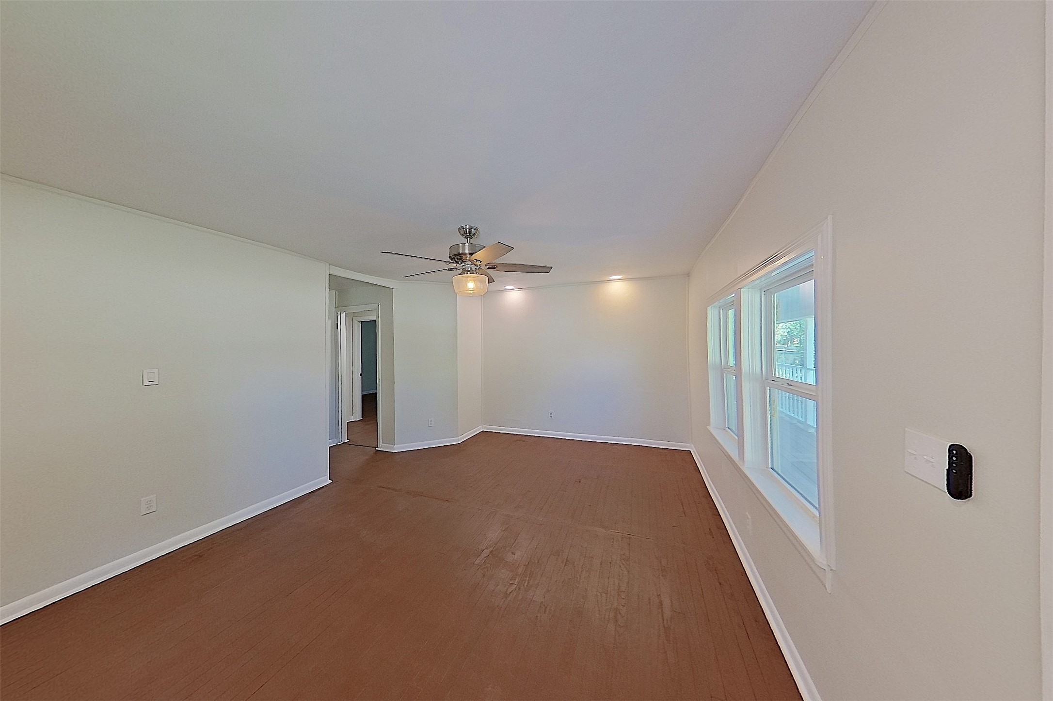 24254 Jane Avenue Porter, TX 77365 - Photo 10 of 26 wooden floor in an empty room with a window