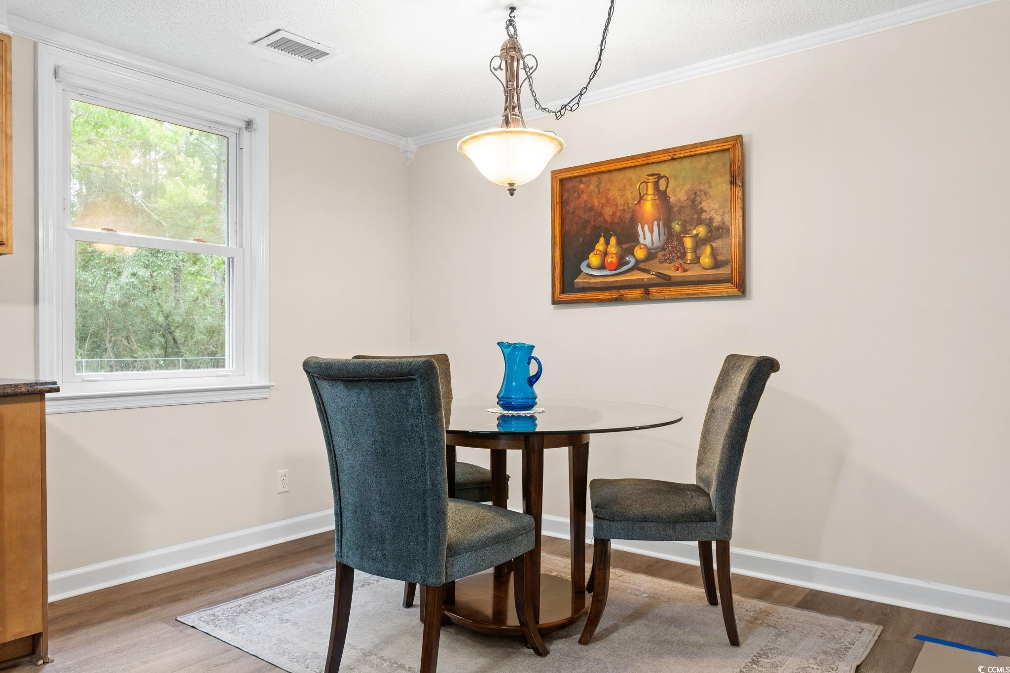 96 Middleton Road Andrews, SC 29510 - Photo 23 of 40 Dining area with wood finished floors, baseboards,