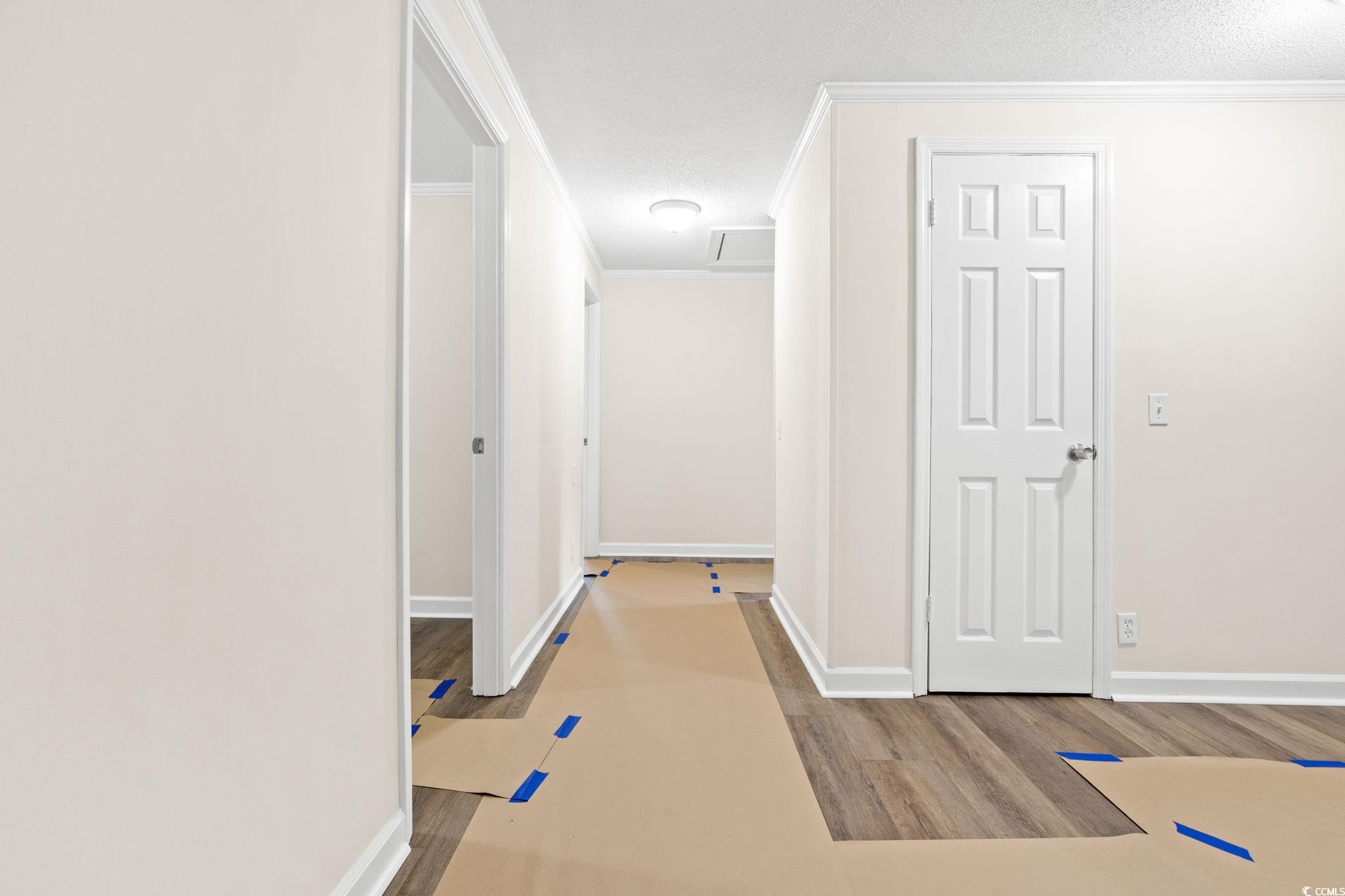 96 Middleton Road Andrews, SC 29510 - Photo 27 of 40 Corridor featuring wood finished floors, crown mol