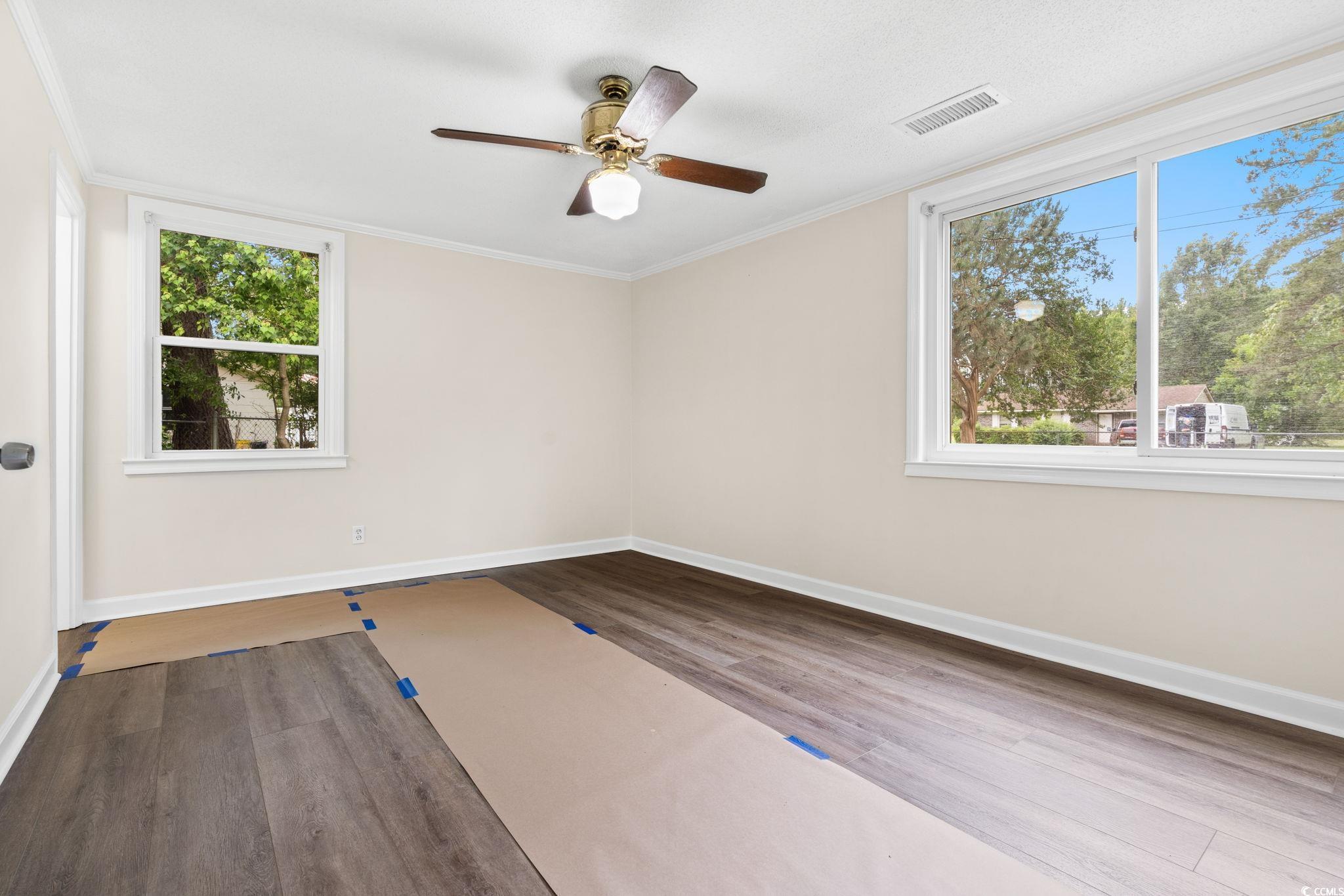 96 Middleton Road Andrews, SC 29510 - Photo 28 of 40 Empty room with wood finished floors, baseboards,