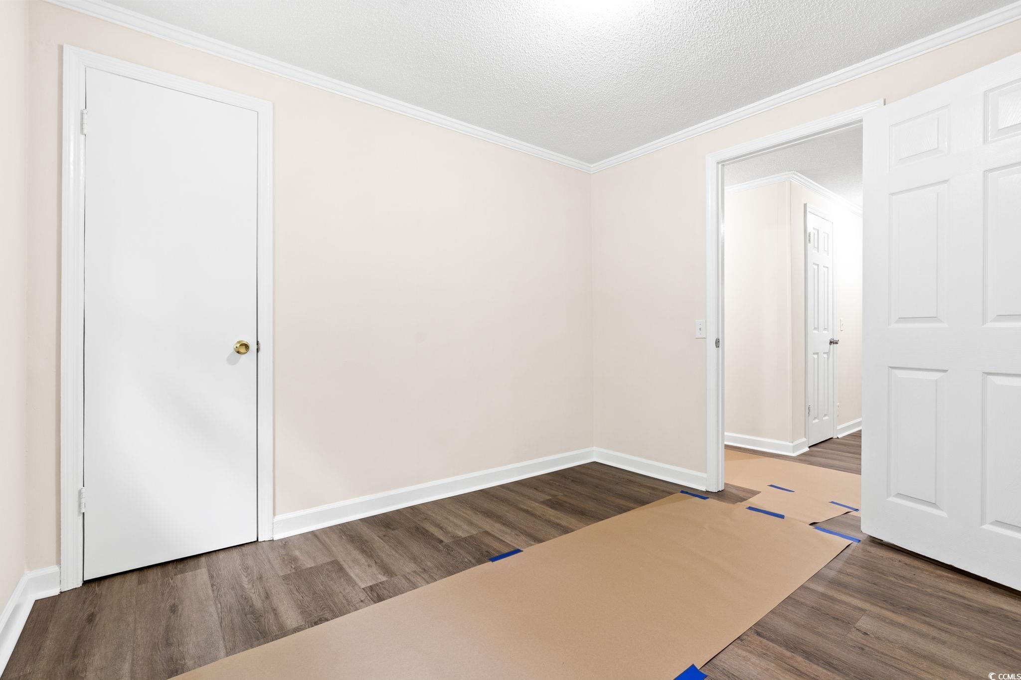 96 Middleton Road Andrews, SC 29510 - Photo 35 of 40 Unfurnished room with wood finished floors, crown
