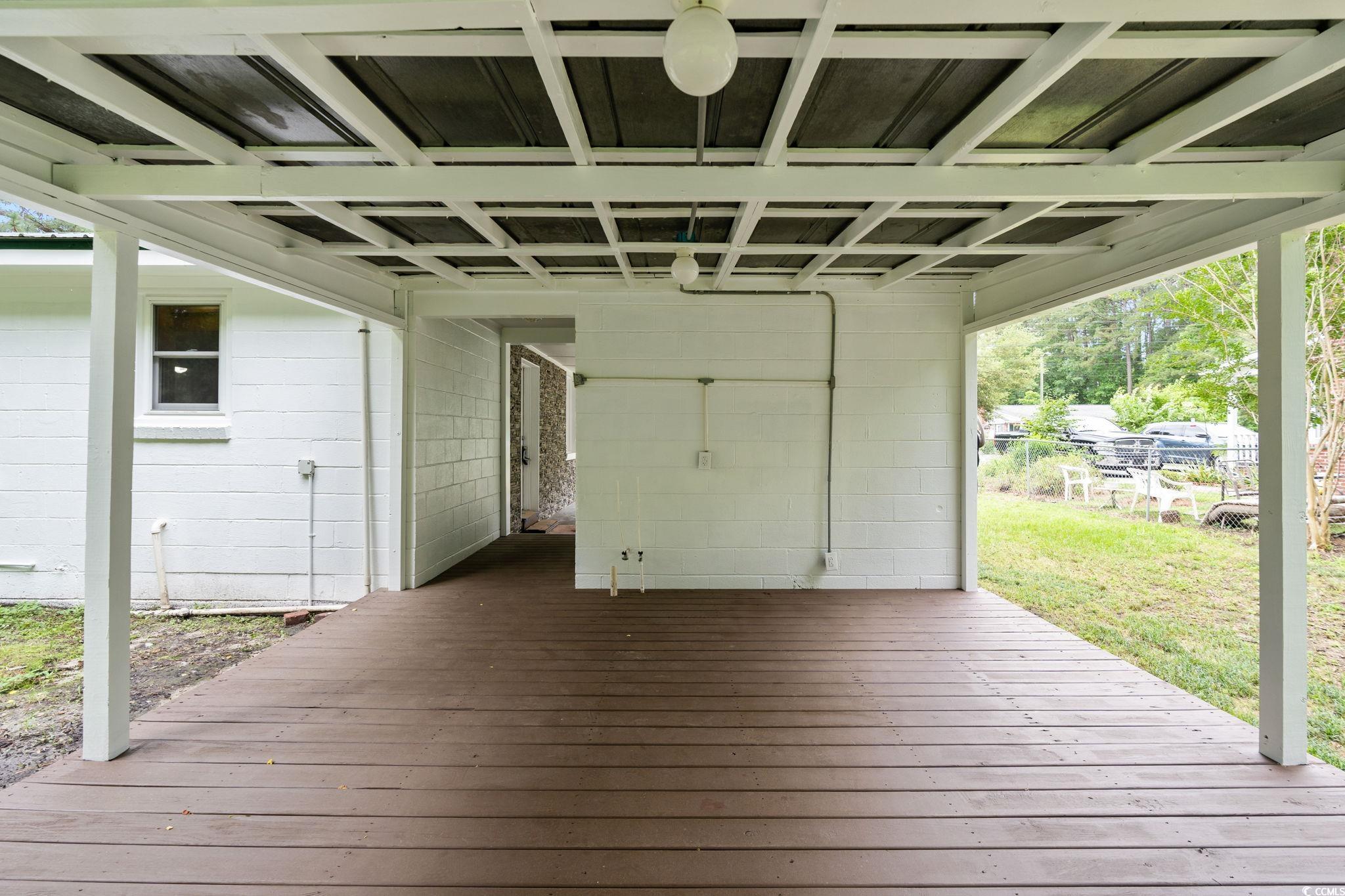 96 Middleton Road Andrews, SC 29510 - Photo 10 of 40 Wooden deck featuring a carport and a yard