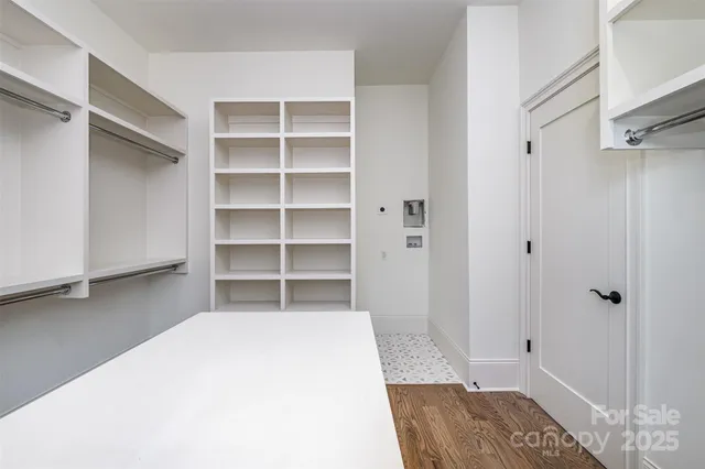 a room with closet and mirror